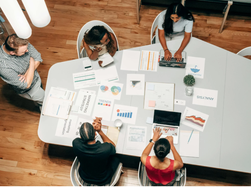 Agency outsourcing workflow showing a B2B marketing team collaborating with external specialists
